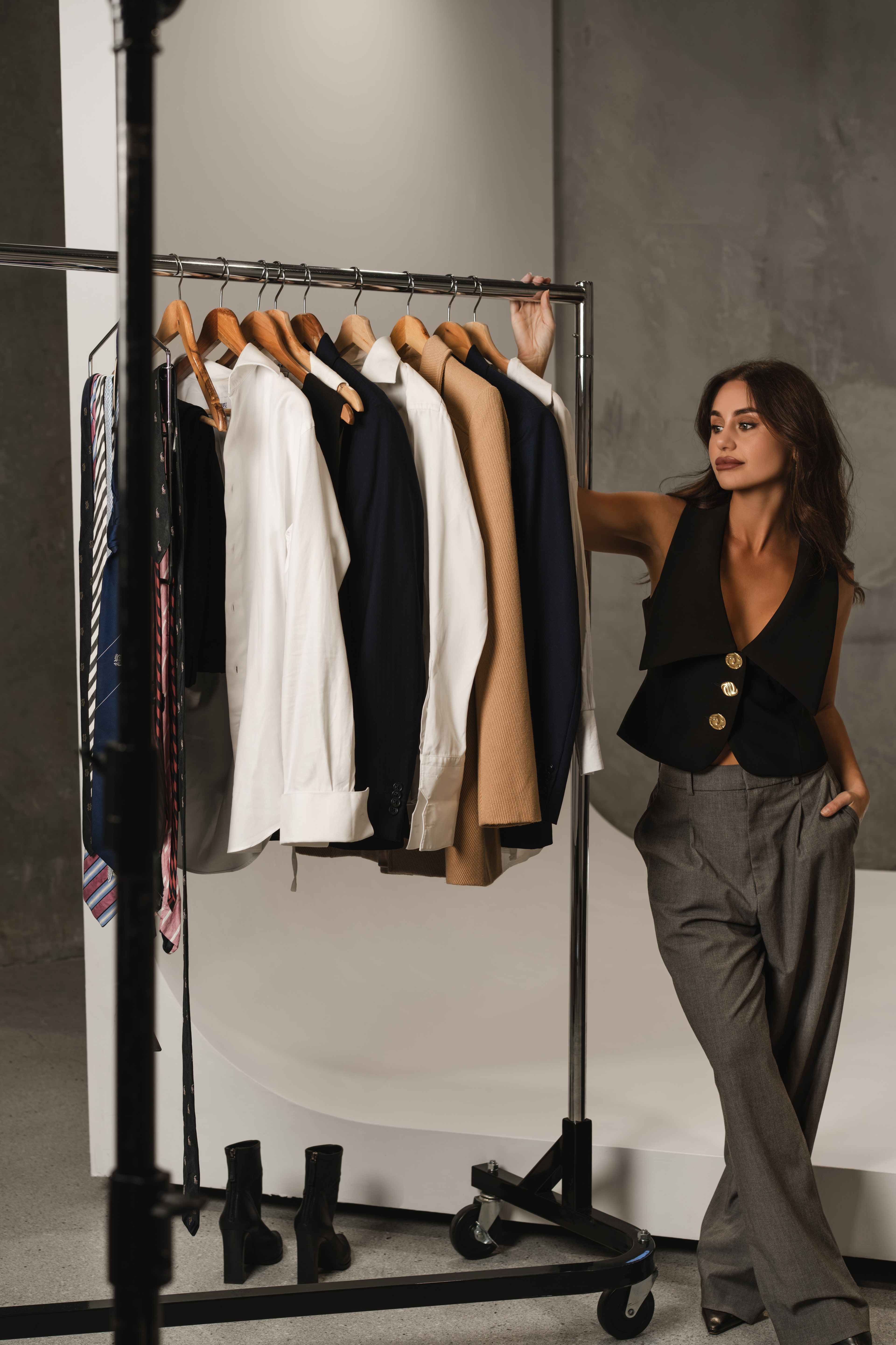 Fifi Rochet on set with wardrobe rack and suiting